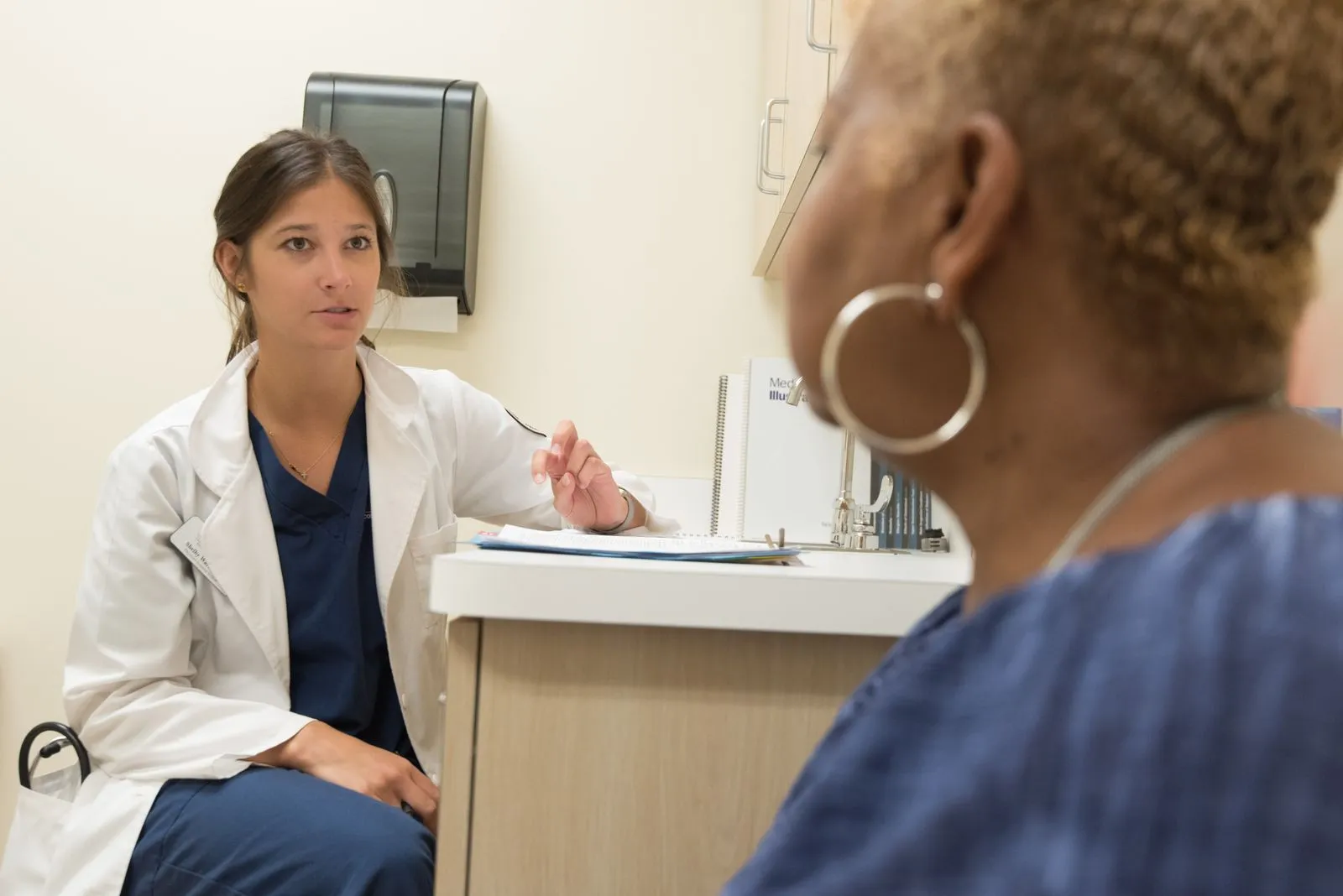 Doctor talking with a patient during an urgent care visit in Haines City