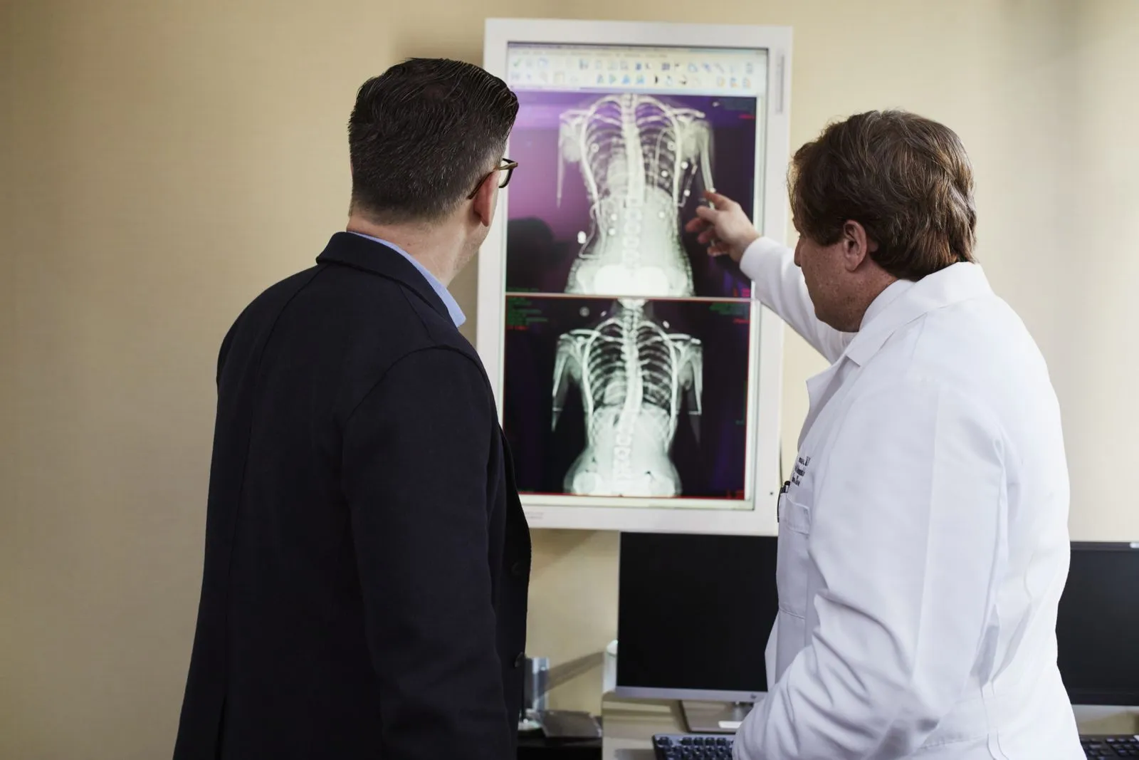 Doctor showing a patient their X-ray results