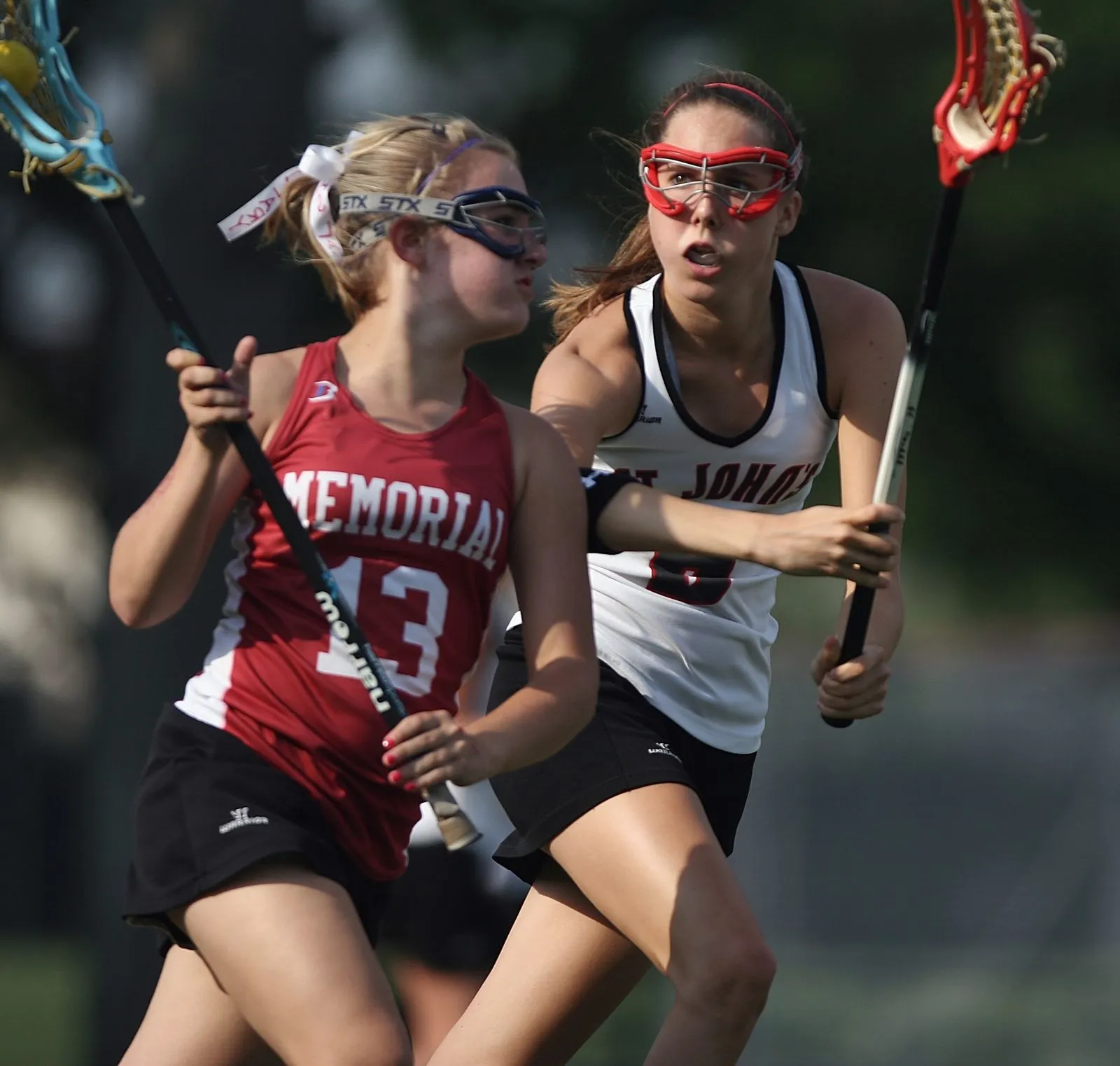 Girls playing lacrosse during a school game