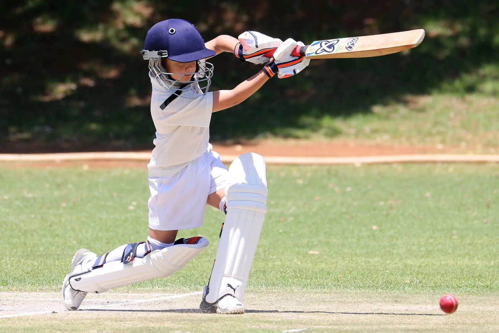 Young athlete batting during a game
