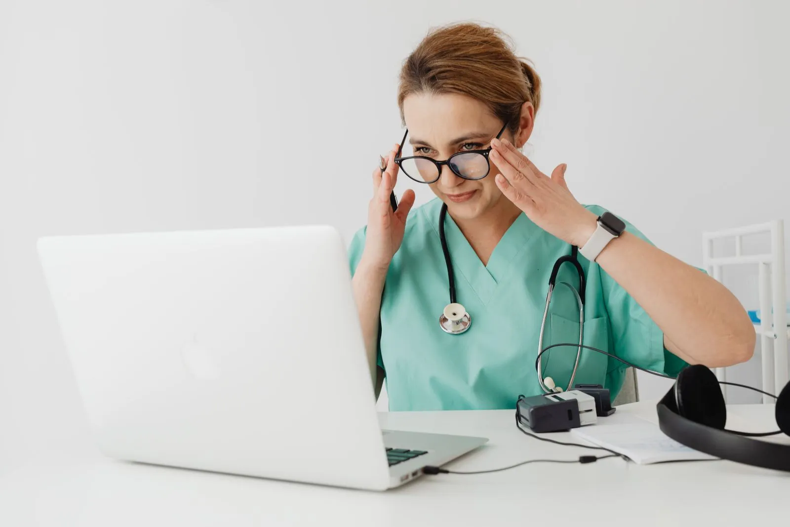 Nurse with a headset on a telehealth video visit