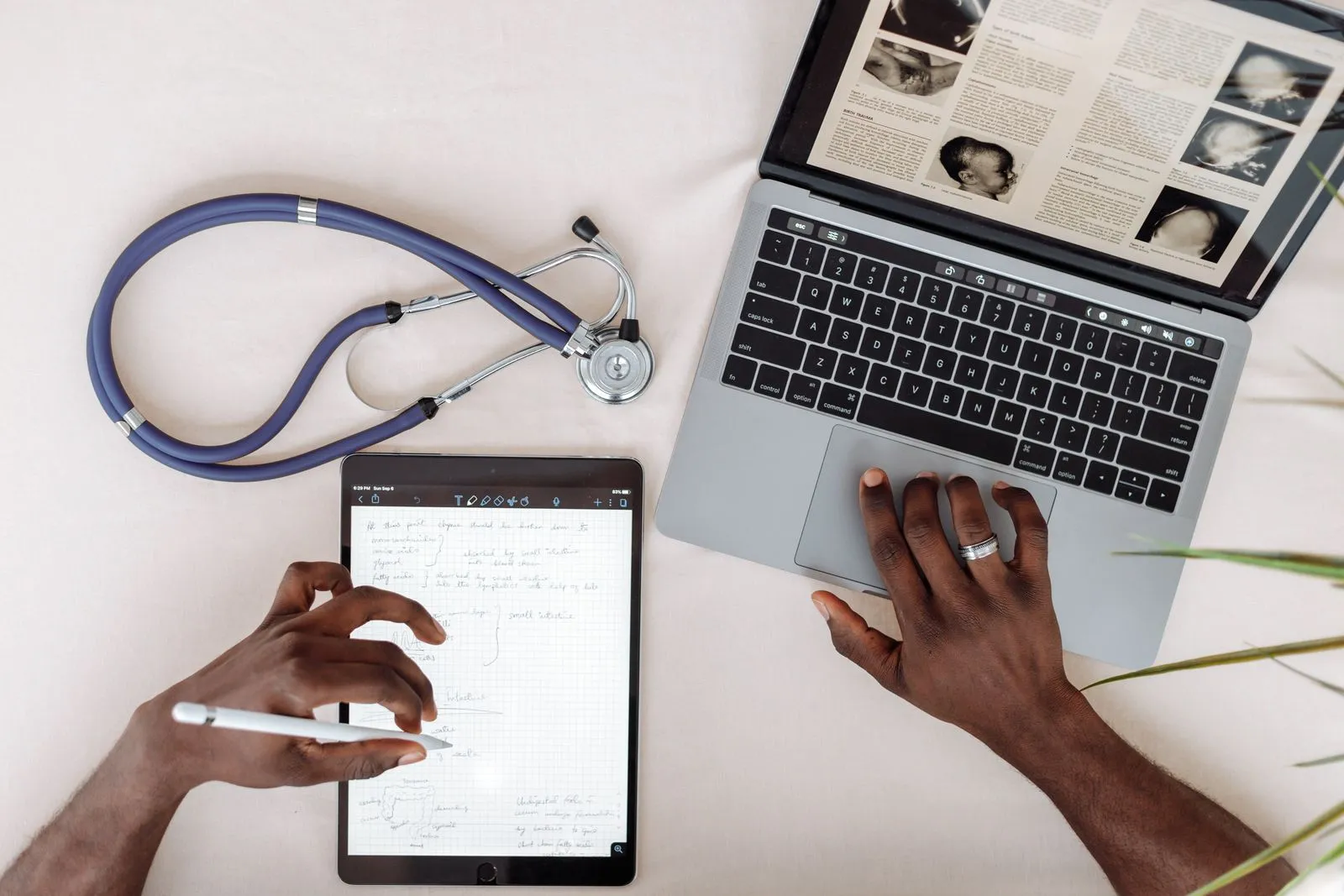 Stethoscope next to a laptop for an online visit